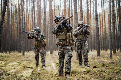 3 men playing mil-sim airsoft.